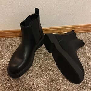 Never worn black boots.